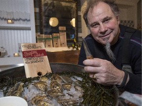 Rodney Clark poses for a photo with his Lyttle oyster knife after teaching an Oyster 101 class at his restaurant, Rodney's Oyster House, in Calgary.