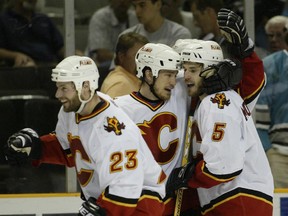 Andrew Ference celebrates with Steve Montador after Montador scored in overtime to defeat the Sharks in game one of the Western Conference finals Sunday, May 9, 2004 at HP Pavillion in San Jose.