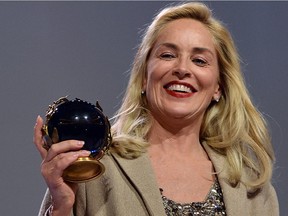 US actress Sharon Stone reacts after she received the Peace Summit Award at the end of the World Summit of Nobel Peace Laureates in October 2013.