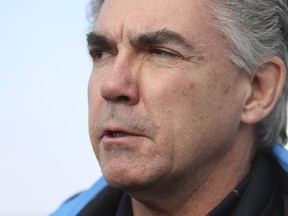 Premier Jim Prentice speaks to media after casting his ballot in his home constituency of Calgary-Mountain View at the Renfrew United Church in Calgary, on February 21, 2015.