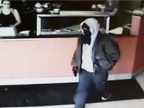 RCMP are searching for two suspects in an armed robbery at approximately 10:20 a.m. on February 21, 2015, at The Filling Station in Wrangler Park, Rocky View County.
