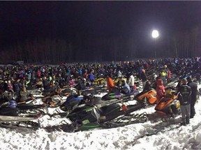 Riders gather for the ASA World Snowmobile Parade in Whitecourt  on Thursday, Feb. 12, 2015. A town in northwestern Alberta may have snowmobiled its way into the record books.