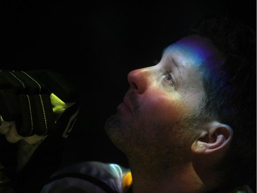 An emotional Rod O'Brien watches a jumbotron tribute to his late son Nathan before the start of the Nathan O'Brien Children's Foundation hockey game Thursday February 5, 2015 at the Saddledome. A team made up of Nathan's family, local police and politicians took on a Calgary Flames Alumni squad.