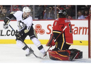 Pittsburgh Penguins centre Nick Spaling can't get his shot past Calgary Flames goalie Jonas Hiller during the second period at the Saddledome Friday February 6, 2015.