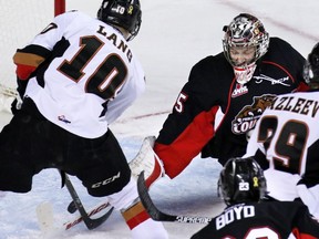 Calgary's Chase Lang couldn't quite get the puck by Prince George Cougars goaltender Ty Edmonds during the first period of WHL action at the Scotiabank Saddledome on Wednesday. Edmonds made 49 saves, making the Hitmen work for a 4-3 shootout victory.