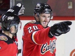 Calgary Flames Curtis Glencross, right, celebrates his goal on the Edmonton Oilers during third period action at the Scotiabank Saddledome in Calgary.