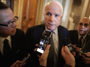 Sen. John McCain talks with reporters before heading into the weekly GOP policy luncheon at the U.S. Captiol February 3, 2015 in Washington, DC.