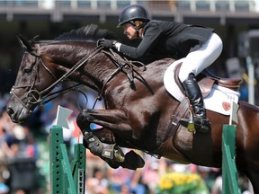 USA's Beezie Madden rides Cortes C to second place in the $80,000 TD Cup at Spruce Meadows during the North American show jumping event on Saturday July 7, 2012.
