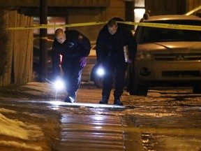 Police investigate the scene of a suspicious death on Whitworth Road N.E. in Whitehorn on Feb. 12, 2015.