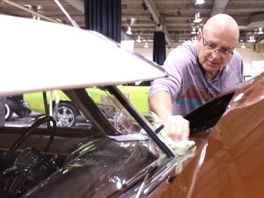 World of Wheels participant Fred Chappell from Calgary worked on shining his 1953 Hudson Hornet - Twin H during the set up for the show at the BMO Centre at the Calgary Stampede Grounds on February 19, 2015. The show runs through the weekend.