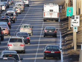 Cars follow a city bus down the Calgary Transit only lane on northbound Crowchild Trail near 17th Avenue S.W. during rush hour Tuesday January 27, 2015.
