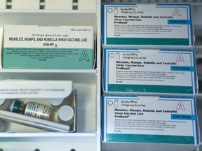 This Thursday, Jan. 29, 2015 file photo shows boxes of the measles, mumps and rubella virus vaccine (MMR) and measles, mumps, rubella and varicella vaccine inside a freezer at a doctor's office in Northridge, Calif. Vaccinations can cause minor side effects including redness at the injection site and sometimes mild fever, but medical experts say serious complications are rare and much less dangerous than the diseases that vaccines prevent.