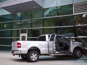 In this file photo, a pickup truck is pictured after having crashing into the Calgary Courthouse on July 29, 2013.