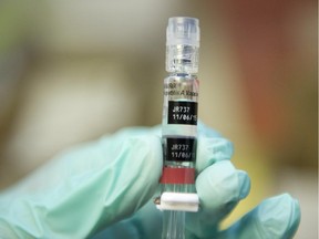 A nurse loads a syringe with a vaccine in Lynwood, California.