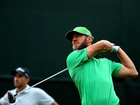 Canadian PGA Tour golfer Graham DeLaet hits a tee shot on 17 during the third round of the Waste Management Phoenix Open last month. In the San Jose area for the Pebble Beach National Pro-Am this week, he was thrilled the Flames invited him and his dad to join the players' fathers at Monday's NHL game.