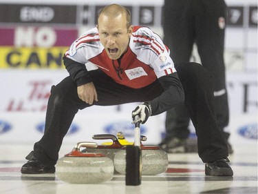 Team Canada skip Pat Simmons yells at his sweepers during a match up against Team Northern Ontario at the Brier in Calgary, on March 5, 2015.