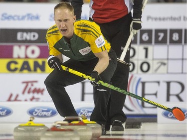 Team Northern Ontario skip Brad Jacobs yells at his sweepers during a match up against Team Canada at the Brier in Calgary, on March 5, 2015.