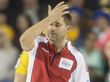 Team Canada third John Morris slaps his forehead in disappointment during a match against Northern Ontario's Brad Jacobs on Thursday night. Although they've made the playoffs, Canada lost 6-3.