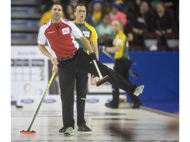 Team Canada third John Morris tries to lean and will his shot into curling during a match up against Team Northern Ontario at the Brier in Calgary, on March 5, 2015.