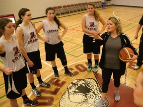 Rundle College girl's basketball coach Laurel Adolphe addresses her team during practice on Wednesday. The Calgary school will host the 2A girls basketball provincials, starting Thursday.
