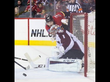 Calgary Flames centre Josh Jooris, centre, shoots past the Colorado Avalanche net at the Scotiabank Saddledome in Calgary on Monday, March 23, 2015. The Calgary Flames lead the Colorado Avalanche, 2-1, in regular season NHL play.
