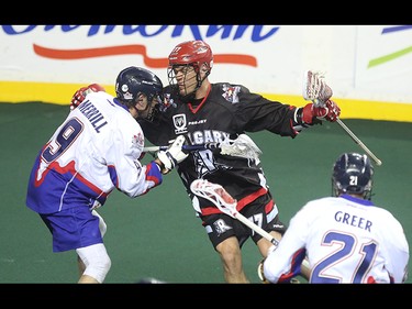 Calgary Roughneck Jeff Shattler, centre, charges the Toronto Rock net at the Scotiabank Saddledome in Calgary on Saturday, March 28, 2015. The Calgary Roughnecks tied Toronto Rock, 5-5, at the half in regular season National Lacrosse League play.