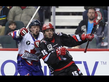 Toronto Rock Jesse Gamble, left, can't stop Calgary Roughneck Shawn Evans from rushing the Rock net at the Scotiabank Saddledome in Calgary on Saturday, March 28, 2015. The Calgary Roughnecks lost to Toronto Rock, 10-12, in regular season National Lacrosse League play.