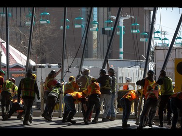 Big Top tent posts are raised for the upcoming Cirque du Soleil show Kurios at Stampede Park in Calgary on Tuesday, March 31, 2015.