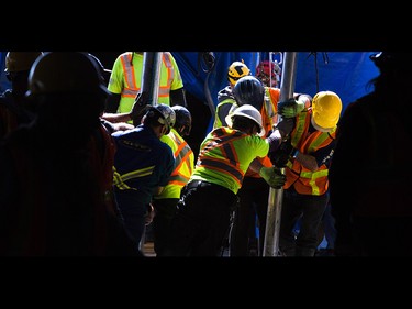 Workers and riggers put up the big tent for the upcoming Cirque du Soleil show Kurios at Stampede Park in Calgary on Tuesday, March 31, 2015. The big top was raised to a height of nearly six stories.