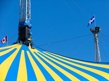 A rigger works on one of the masts outside the big top of the upcoming Cirque du Soleil show Kurios at Stampede Park in Calgary on Tuesday, March 31, 2015. The big top was raised to a height of nearly six stories.