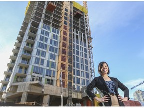 Felicia Mutheardy, senior market analyst for Canada Mortgage and Housing Corp., near residential condo construction in downtown Calgary, on December 17, 2014.