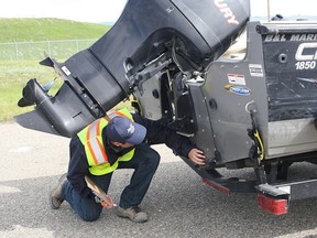 Border patrol inspects a boat for mussel infestation.