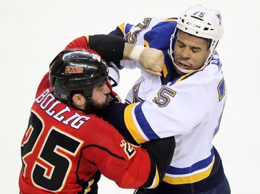 Flames Brandon Bollig, left and St. Louis Blues Ryan Reaves fight
