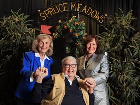 Marg and Ron Southern pose with daughter Linda Southern-Heathcott, in front of one of the original jumps that was used at Spruce Meadows 40 years ago.