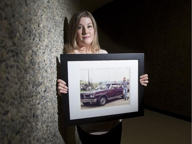 Kala Ortwein, a 26-year-old master of arts student at the University of Calgary, grew up having a homeless father, the man in the photograph she holds on March 20, 2015. Ortwein is working on a research study which examines the experiences of daughters of homeless men.