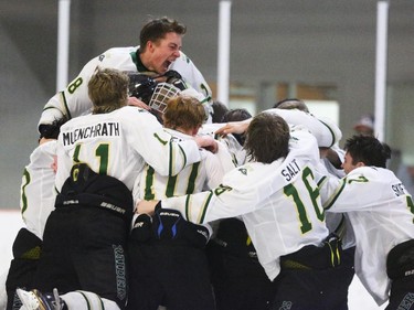 The Rocky Mountain Raiders cheer their gold medal victory in DeWinton, Alberta on Tuesday, March 24, 2015. The Rocky Mountain Raiders won over the Fort Saskatchewan Rangers, 5-2, in the deciding game five of the Alberta Major Bantam AAA League final.
