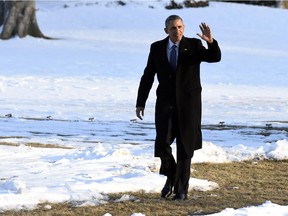 President Barack Obama waves after walking off of Marine One on the South Lawn of the White House in Washington, Friday, March 6, 2015. Obama was returning from a trip to Columbia, S.C.