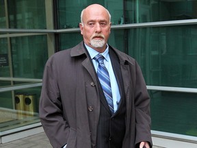Barry Brown leaves the Calgary Courts Centre ion Tuesday, February 12, 2013.