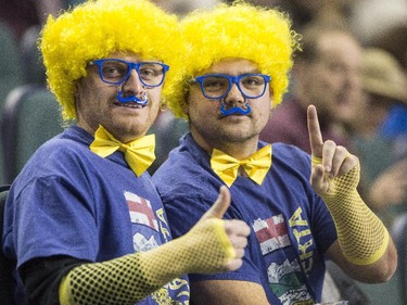 Fans dress up and cheer for Team Alberta at the 2015 Tim Hortons Brier at the Saddledome in Calgary, on March 2, 2015.