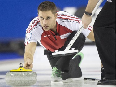 Team Canada skip John Morris throws a stone during a match against Team New Brunswick at the 2015 Tim Hortons Brier at the Saddledome in Calgary, on March 2, 2015.