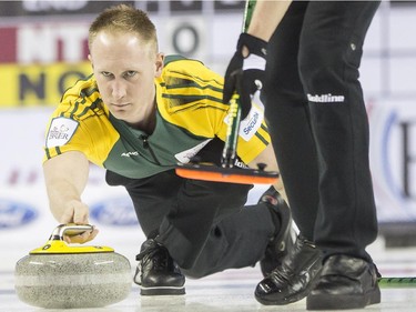 Team Northern Ontario skip Brad Jacobs releases a stone during a match against Team Northwest Territories at the 2015 Tim Hortons Brier at the Saddledome in Calgary, on March 2, 2015.