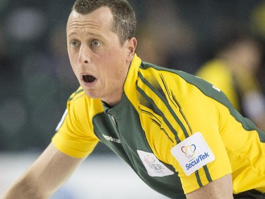 Team Northern Ontario second E.J Harnden watches after he releases a stone during a match against Team Northwest Territories at the 2015 Tim Hortons Brier at the Saddledome in Calgary, on March 2, 2015.