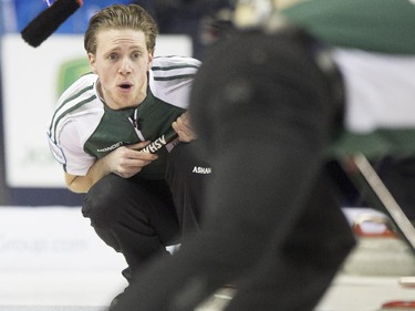 Team PEI skip Adam Casey as a rock slides in during a match against Team Quebec at the 2015 Tim Hortons Brier at the Saddledome in Calgary, on March 2, 2015.