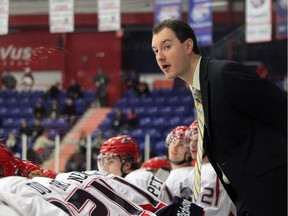 Brooks Bandits head coach Ryan Papaioannou presides behind the bench during a 2012 game. He leads his Bandits into a first-round Alberta Junior Hockey League playoff series against the Calgary Mustangs, starting Thursday.