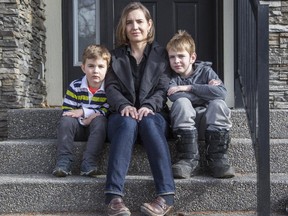 Natalie Odd, with her two children, Mateo Benson, right, 8, and Sebastian Benson, 4, is worried about how the new budget is going to affect her family in Calgary.