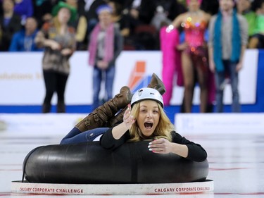 Human curlers take to the ice during a break between ends during the gold medal final of the 2015 Tim Hortons Brier on Sunday March 8, 2015.