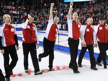 Team Canada waves to the Scotiabank Saddledome crowd as they walk to the 2015 Tim Hortons Brier award ceremonies