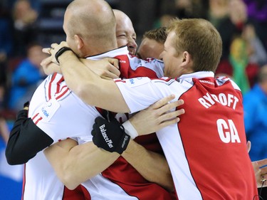 Team Canada celebrates winning the gold medal final of the 2015 Tim Hortons Brier on Sunday March 8, 2015. Team Canada downed Brad Jacobs' Northern Ontario team 6-5 in an extra end.