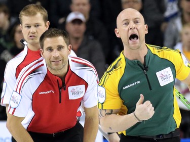 A range of emotions showed on the faces of Northern Ontario third Ryan Fry, right and Team Canada's Carter Rycroft and John Morris as they watch Brad Jacobs' shot during  the gold medal final of the 2015 Tim Hortons Brier on Sunday March 8, 2015.