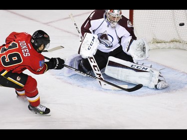 Calgary Flames forward David Jones scores on Colorado Avalanche goaltender Semyon Varlamov during first period NHL action at the Scotiabank Saddledome Monday March 23, 2015.